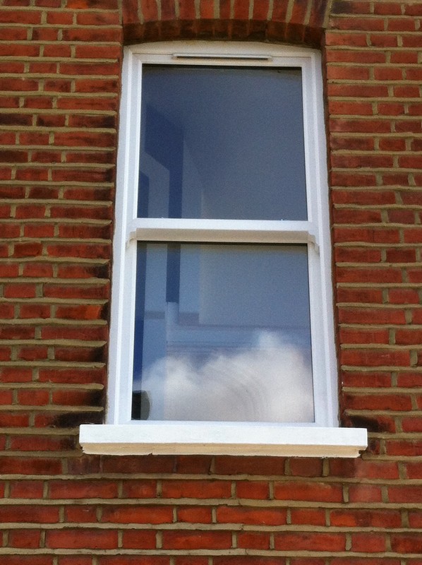 uPVC sash window on Victorian red brick house in Southgate